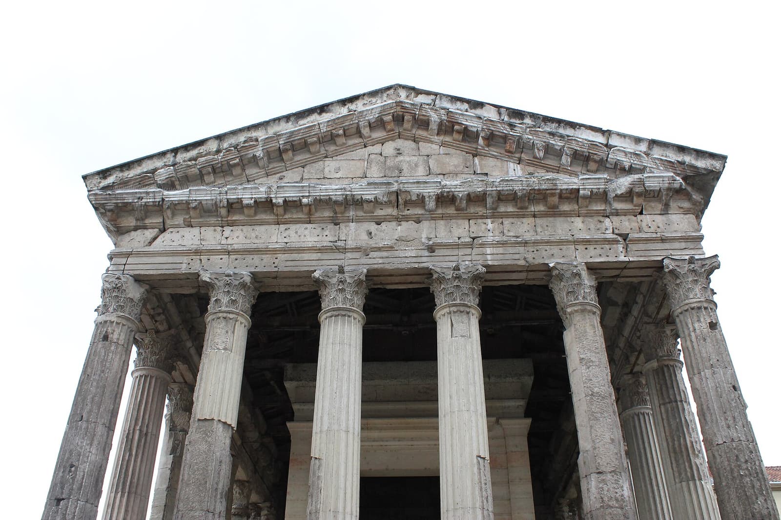 Corinthian columns and stone pediment of the Roman Temple of Augustus and Livia in Vienne