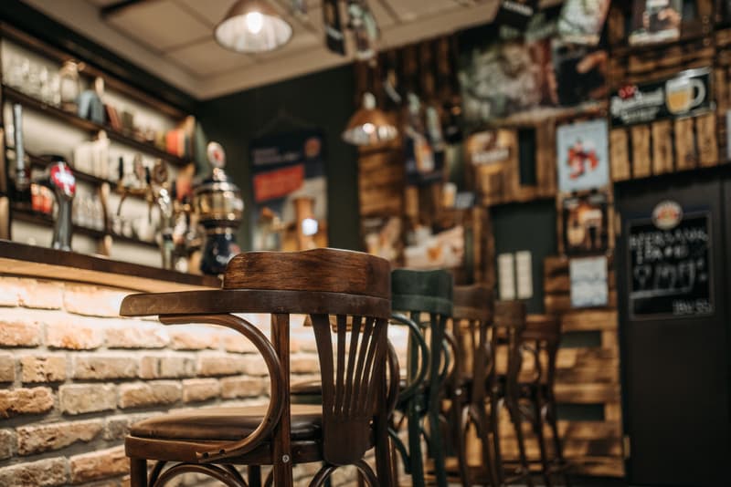 Bentwood bar stools along the counter of a traditional pub